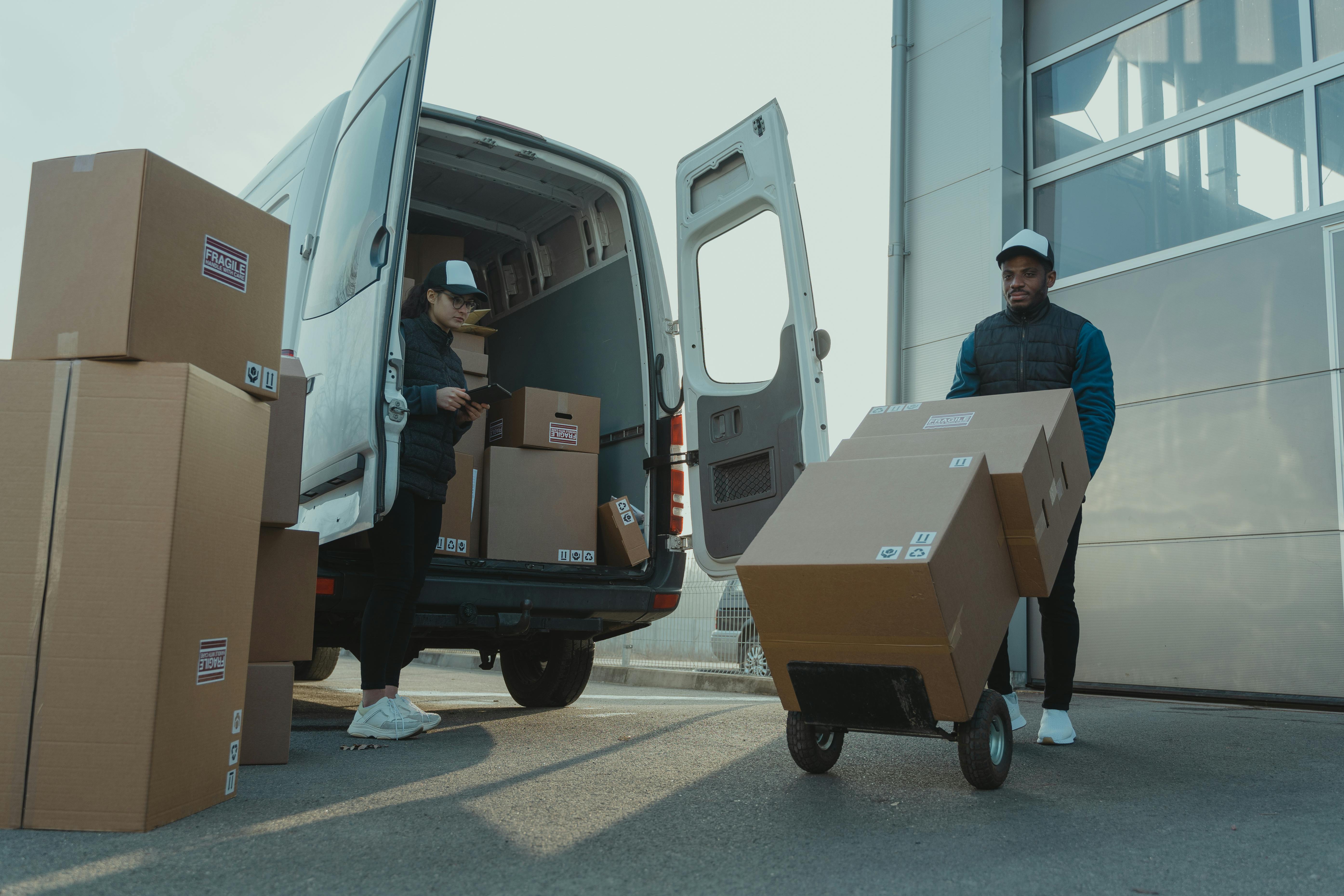 Man and woman unloading van