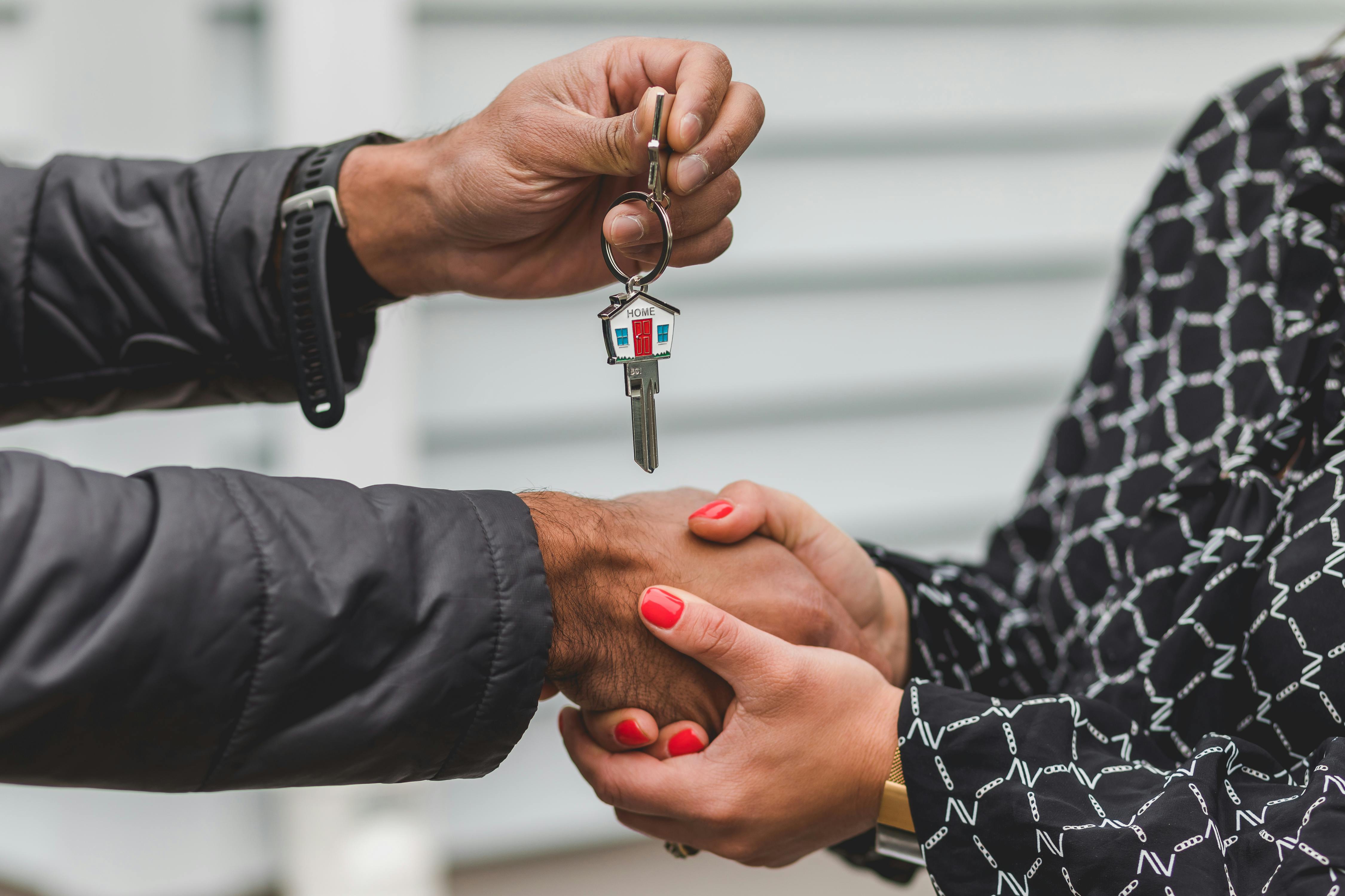 House keys being handed to new homeowner with a mortgage