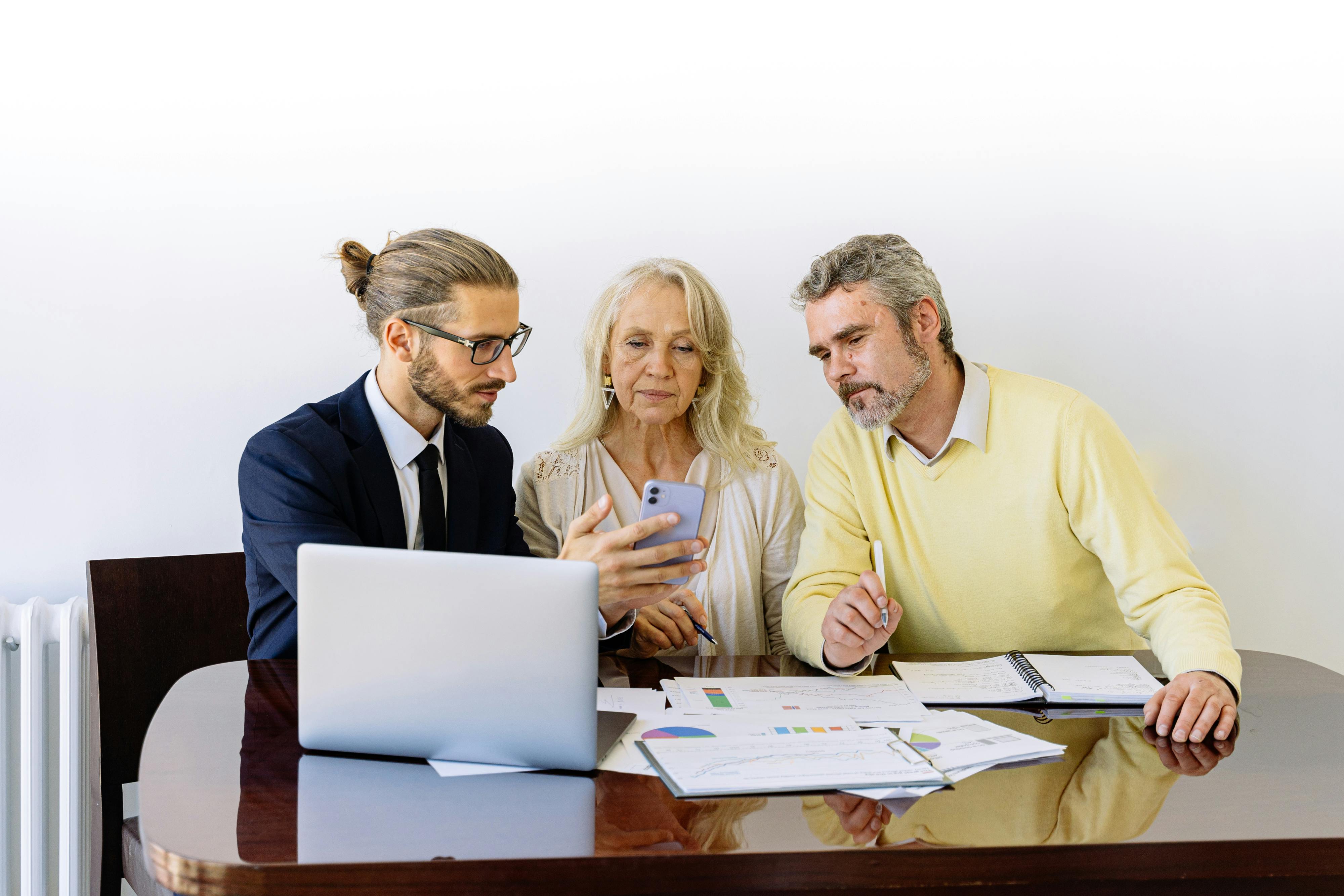 A couple in discussion with a financial advisor.